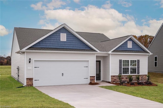 craftsman-style home with concrete driveway, roof with shingles, an attached garage, stone siding, and a front yard