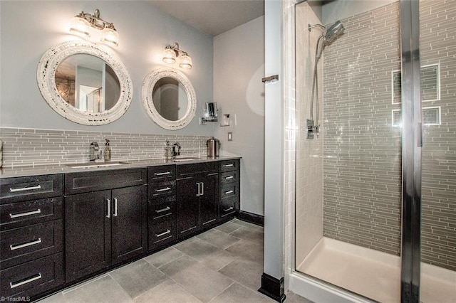 bathroom featuring decorative backsplash, a shower with door, double vanity, and tile patterned flooring