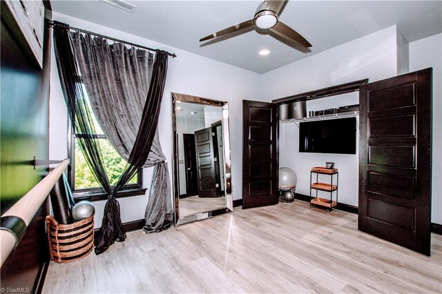 bathroom featuring hardwood / wood-style flooring and toilet