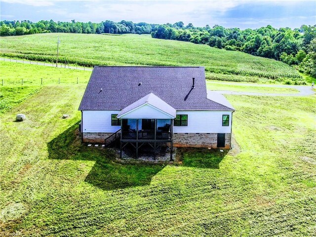 birds eye view of property with a rural view