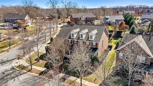 birds eye view of property with a residential view