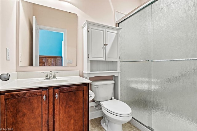 full bath with toilet, tile patterned flooring, an enclosed shower, and vanity