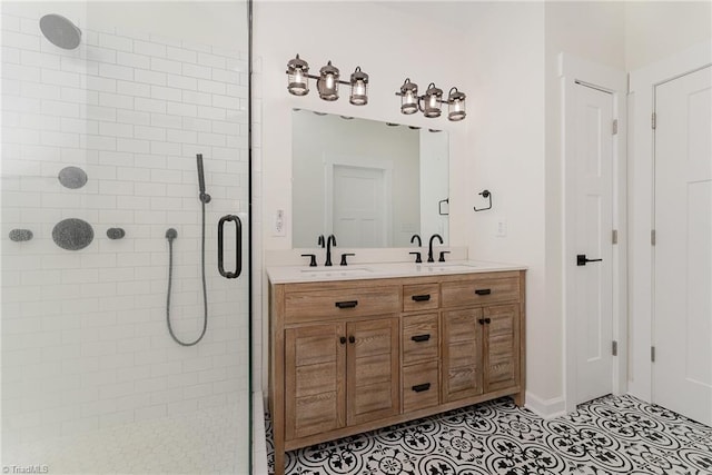 bathroom featuring vanity, a shower with shower door, and tile patterned floors