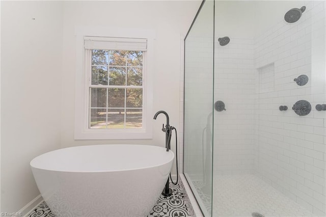 bathroom featuring separate shower and tub and tile patterned floors