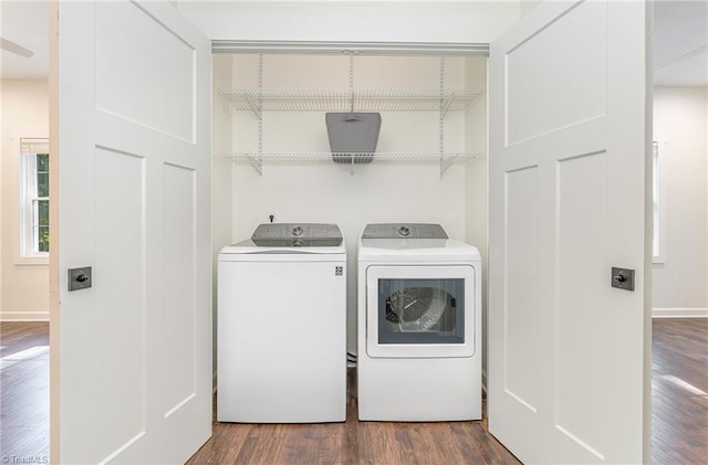 laundry area with washing machine and dryer and dark hardwood / wood-style flooring