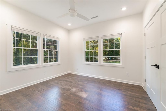 unfurnished room featuring ceiling fan and dark hardwood / wood-style flooring