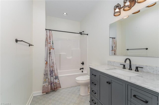 full bathroom featuring toilet, vanity, tile patterned floors, and shower / tub combo