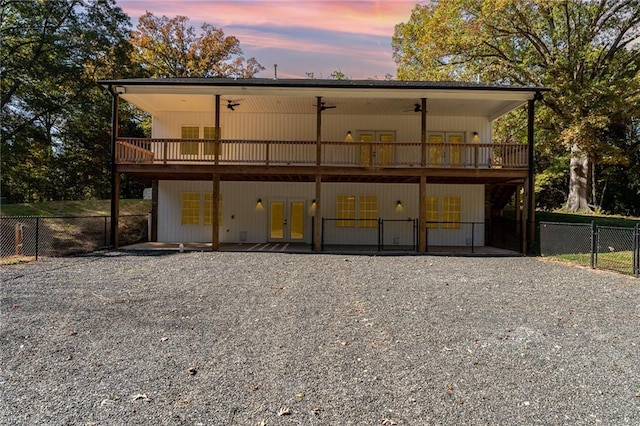 back house at dusk with french doors