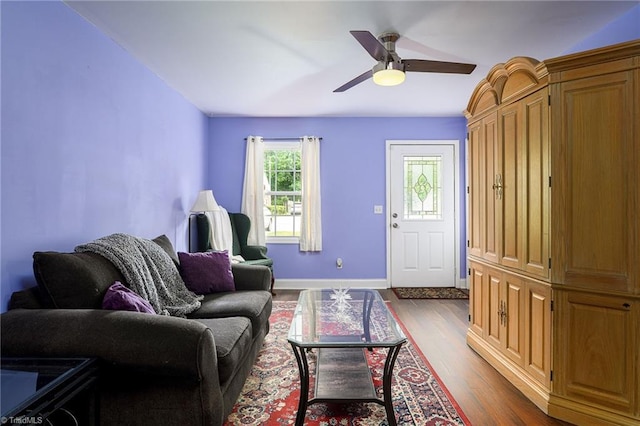 1519 Graves Ave, High Point, NC 27260 - living room featuring dark wood finished floors, a ceiling fan, and baseboards
