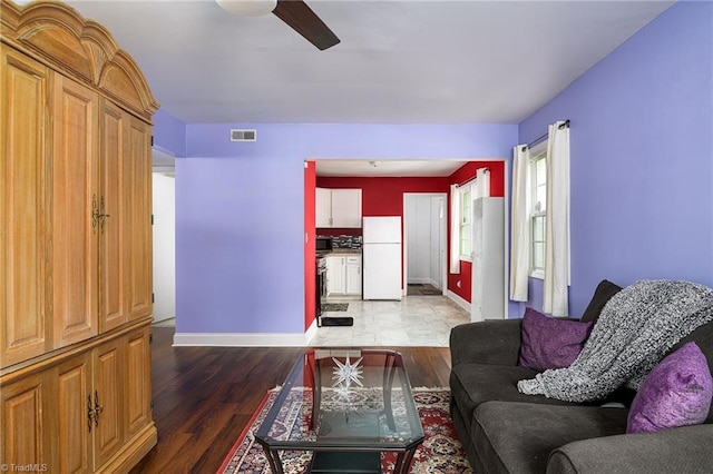1519 Graves Ave, High Point, NC 27260 - living area with baseboards, a ceiling fan, and wood finished floors