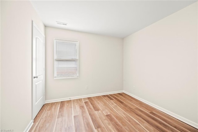 spare room featuring light hardwood / wood-style floors