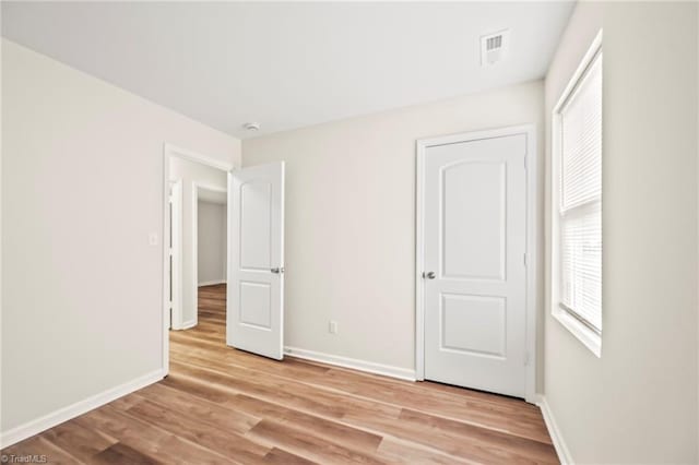 unfurnished bedroom with light hardwood / wood-style floors