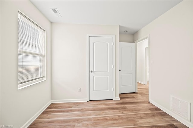 unfurnished bedroom with light hardwood / wood-style floors