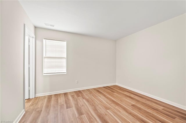 unfurnished room with light hardwood / wood-style floors