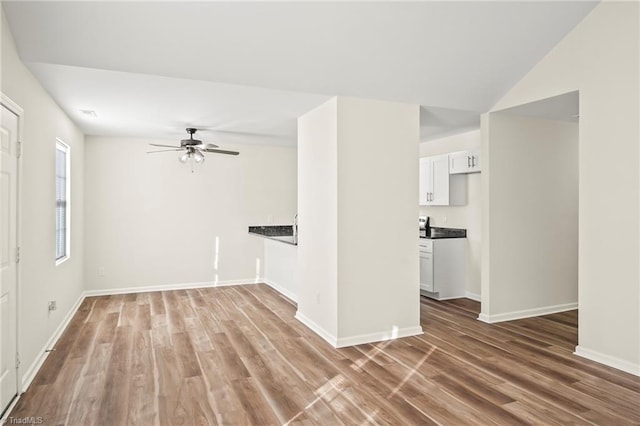 spare room featuring hardwood / wood-style flooring and ceiling fan