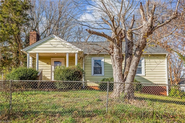 bungalow-style house with a front yard