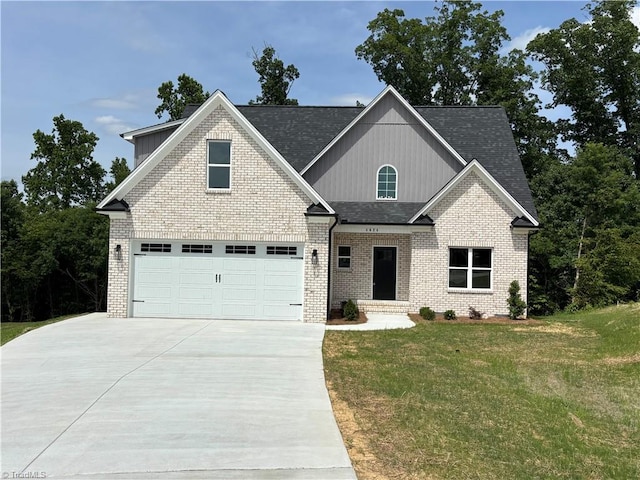4624 Orchard Grove Dr, Clemmons, NC 27012 - craftsman house with concrete driveway, a front lawn, a garage, brick siding, and roof with shingles