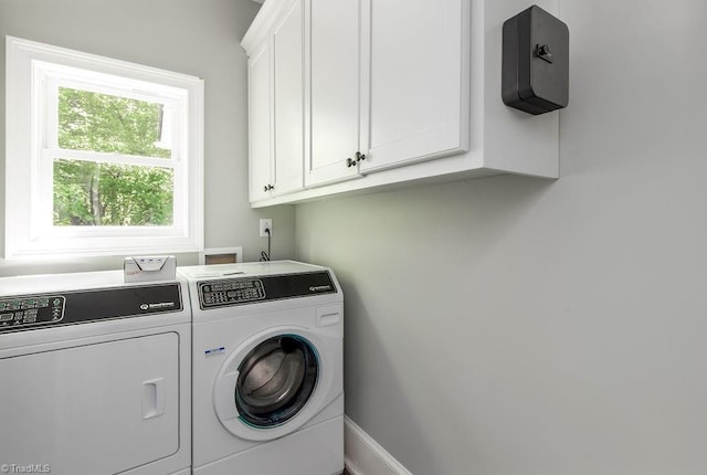 laundry room with cabinet space and independent washer and dryer