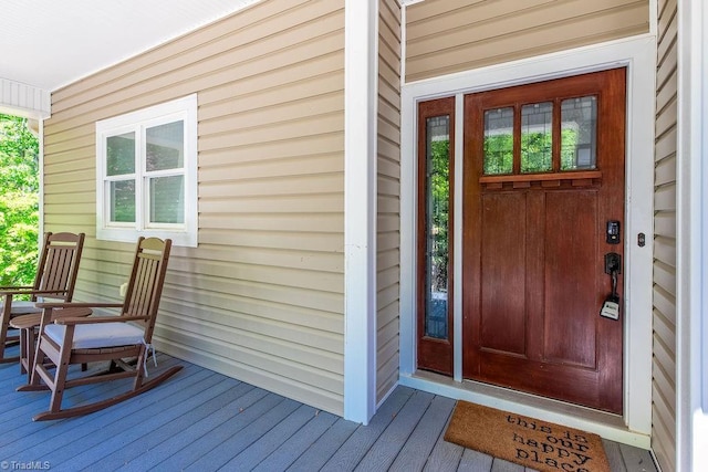 doorway to property featuring covered porch