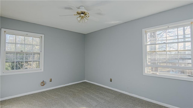 empty room featuring carpet flooring and ceiling fan