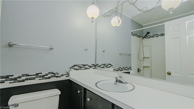 bathroom with backsplash, toilet, walk in shower, and vanity