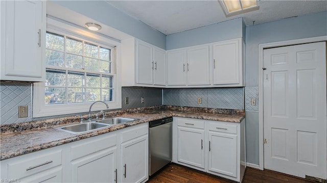 kitchen with sink, white cabinetry, and stainless steel dishwasher