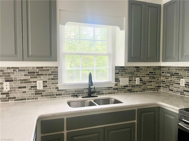 258 S Boyles St, Pilot Mountain, NC 27041 - kitchen featuring a sink, backsplash, and light stone counters