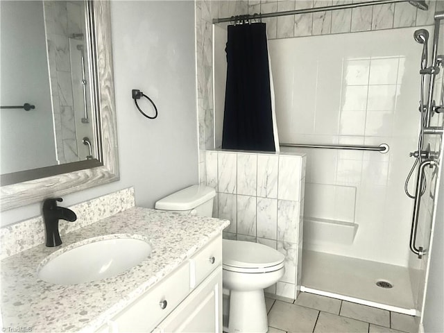 258 S Boyles St, Pilot Mountain, NC 27041 - full bath featuring a shower stall, tile patterned floors, toilet, and vanity