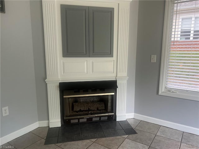 258 S Boyles St, Pilot Mountain, NC 27041 - detailed view of baseboards and a fireplace with flush hearth