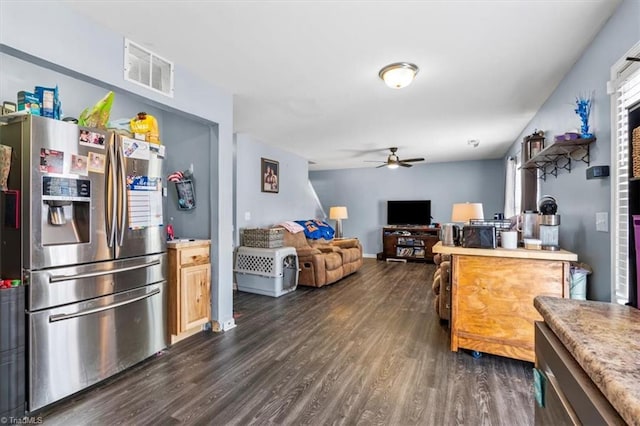 kitchen with stainless steel fridge, dark hardwood / wood-style floors, and ceiling fan