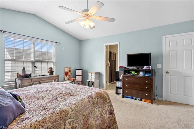 bedroom with light carpet, vaulted ceiling, and ceiling fan