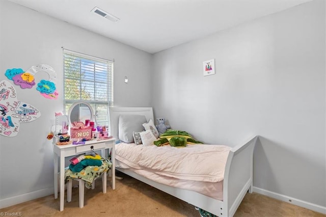 bedroom with light colored carpet