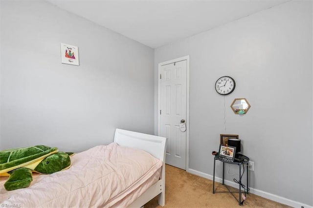 bedroom featuring light colored carpet