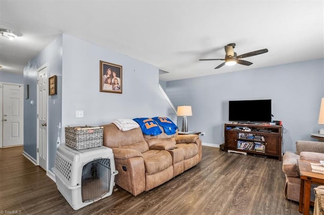 living room with ceiling fan and dark hardwood / wood-style flooring