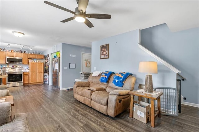 living room featuring dark hardwood / wood-style floors and ceiling fan