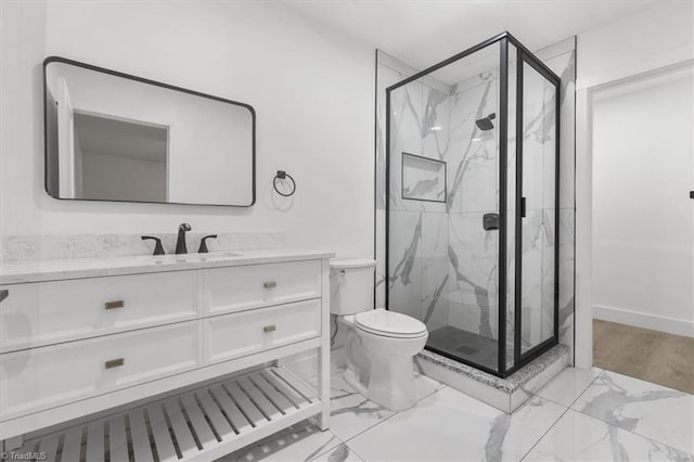 full bathroom with vanity, toilet, marble finish floor, and a marble finish shower