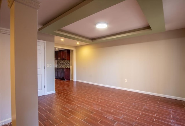 unfurnished living room with a tray ceiling