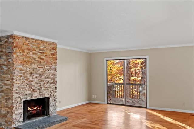 unfurnished living room with ornamental molding and a fireplace