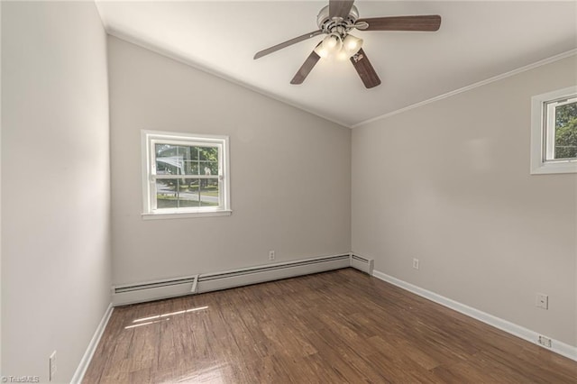 empty room featuring a healthy amount of sunlight, dark wood-type flooring, a baseboard radiator, and lofted ceiling