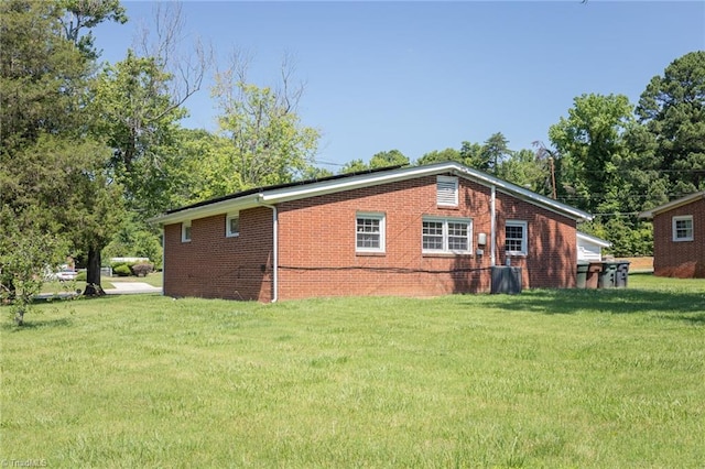 view of property exterior featuring a lawn