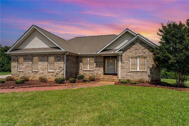 4060 Tarmac Dr, Sophia, NC 27350 - view of front of home featuring a lawn, brick siding, and a shingled roof