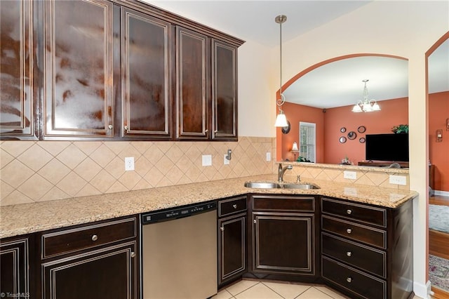 4060 Tarmac Dr, Sophia, NC 27350 - kitchen featuring dishwasher, arched walkways, backsplash, and a chandelier