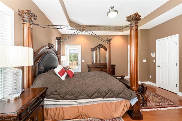 4060 Tarmac Dr, Sophia, NC 27350 - bedroom with decorative columns, wood finished floors, and access to exterior
