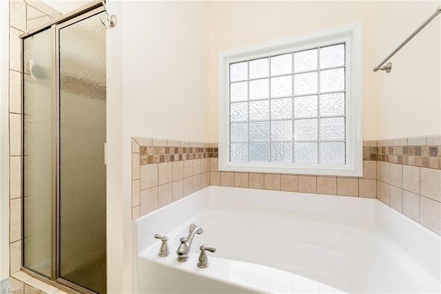 4060 Tarmac Dr, Sophia, NC 27350 - bathroom featuring healthy amount of natural light, a shower stall, and a garden tub