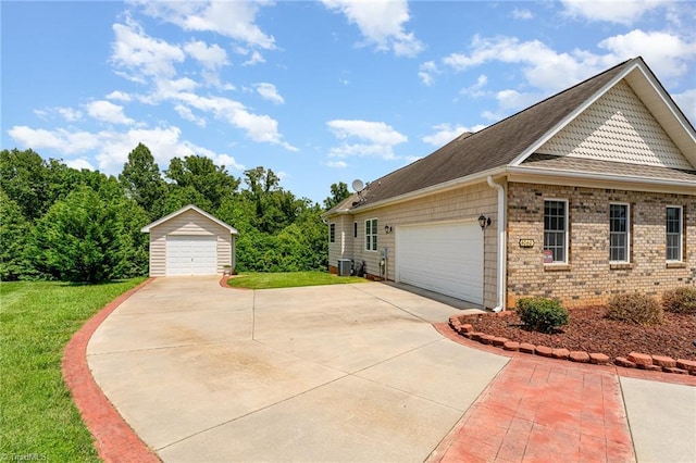 4060 Tarmac Dr, Sophia, NC 27350 - view of side of property featuring a yard, an outbuilding, brick siding, and a shingled roof