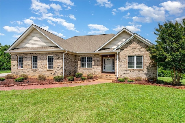 4060 Tarmac Dr, Sophia, NC 27350 - craftsman-style house with a front yard, brick siding, and a shingled roof