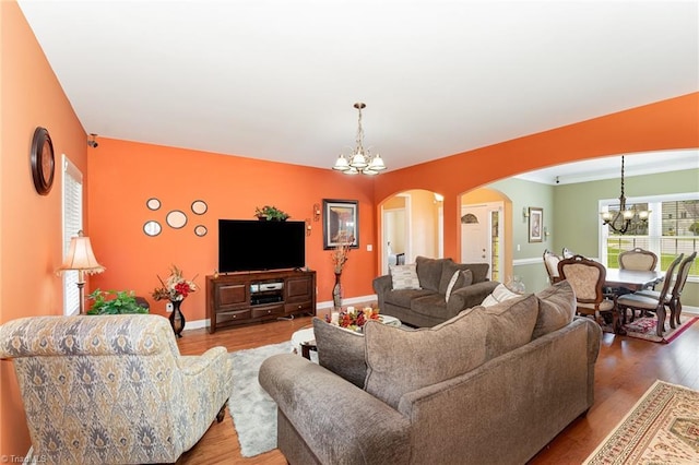 4060 Tarmac Dr, Sophia, NC 27350 - living area with a chandelier, arched walkways, and wood finished floors