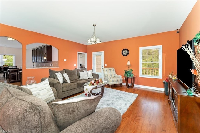 4060 Tarmac Dr, Sophia, NC 27350 - living area with a chandelier, light wood-style floors, and arched walkways