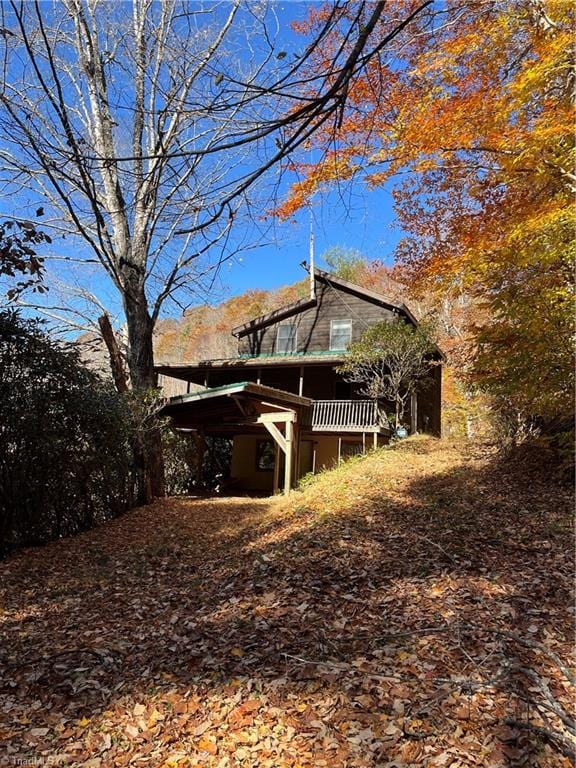 view of side of property with a carport