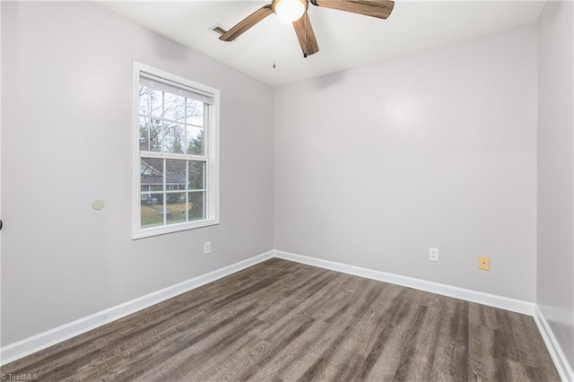 empty room featuring hardwood / wood-style floors and ceiling fan